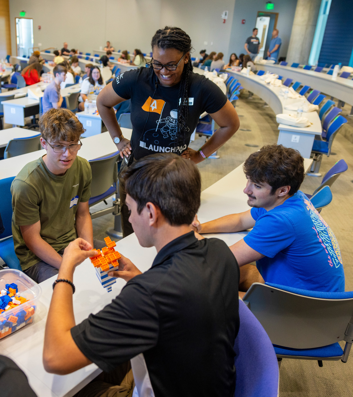 student sitting in class with other students