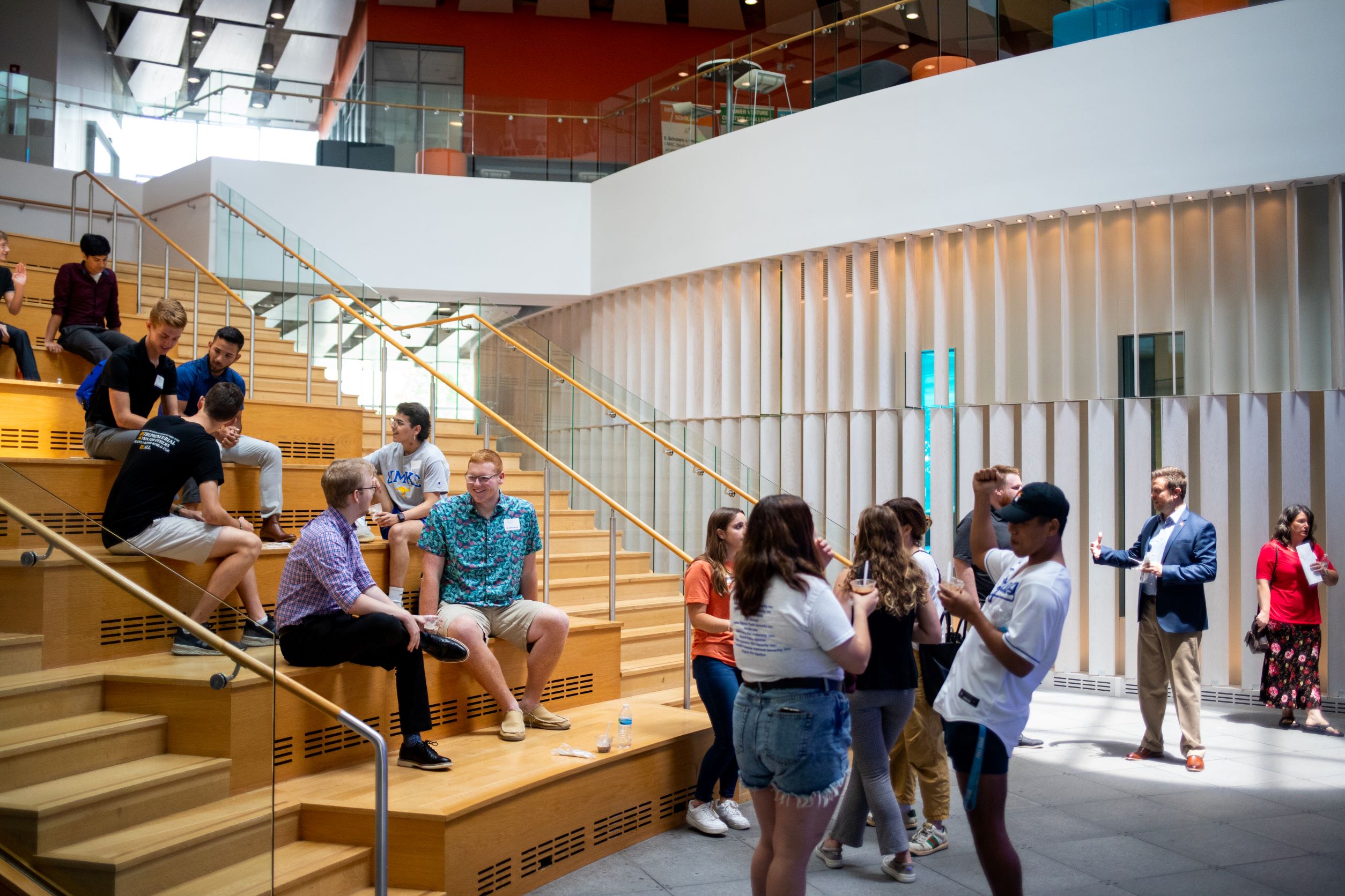 students on the atrium steps