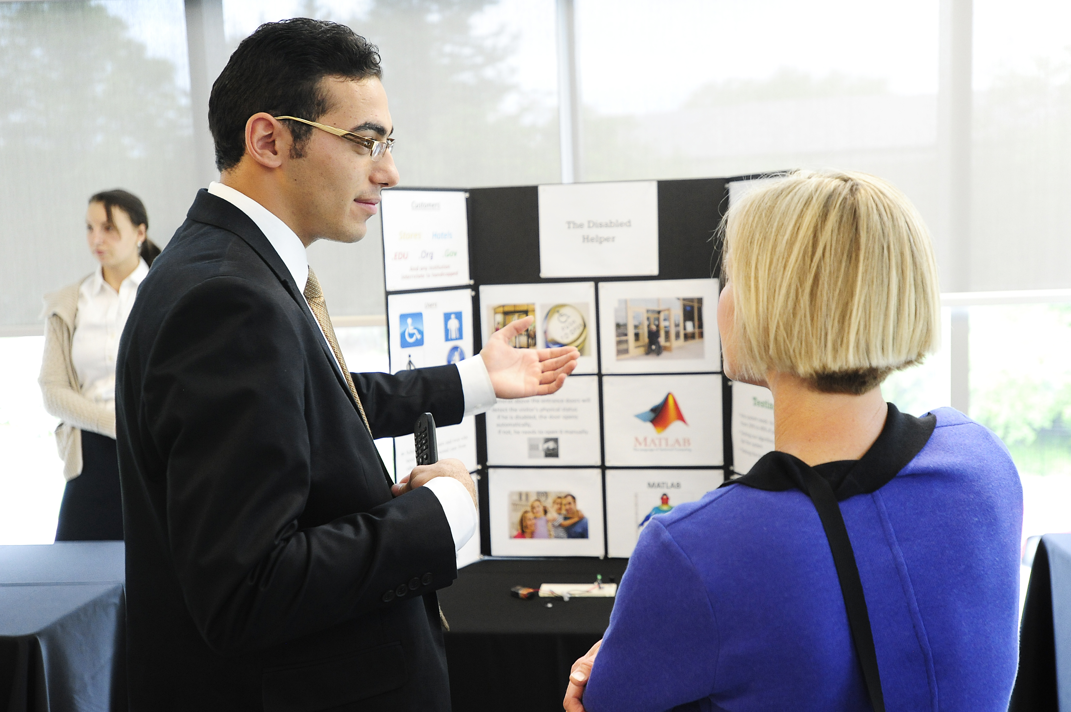 Employer with presentation talking to student
